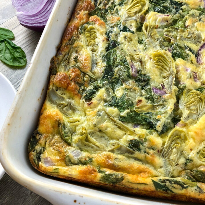 spinach artichoke egg casserole in a baking pan