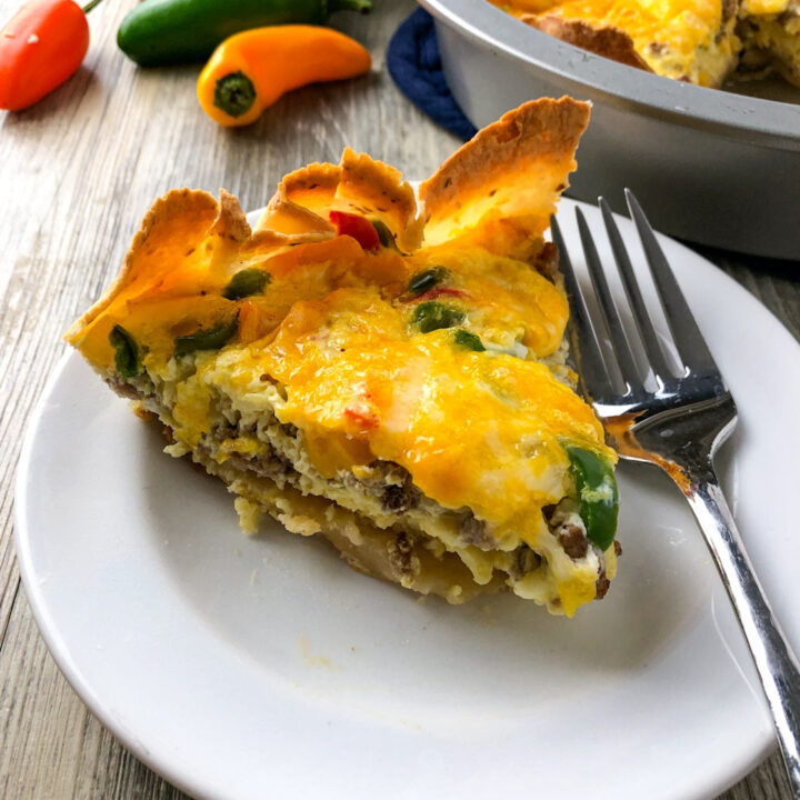 a slice of southwest sausage quiche with melted cheese on top