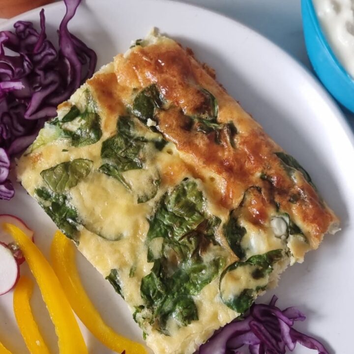top view of a piece of high protein cottage cheese egg bake on a plate